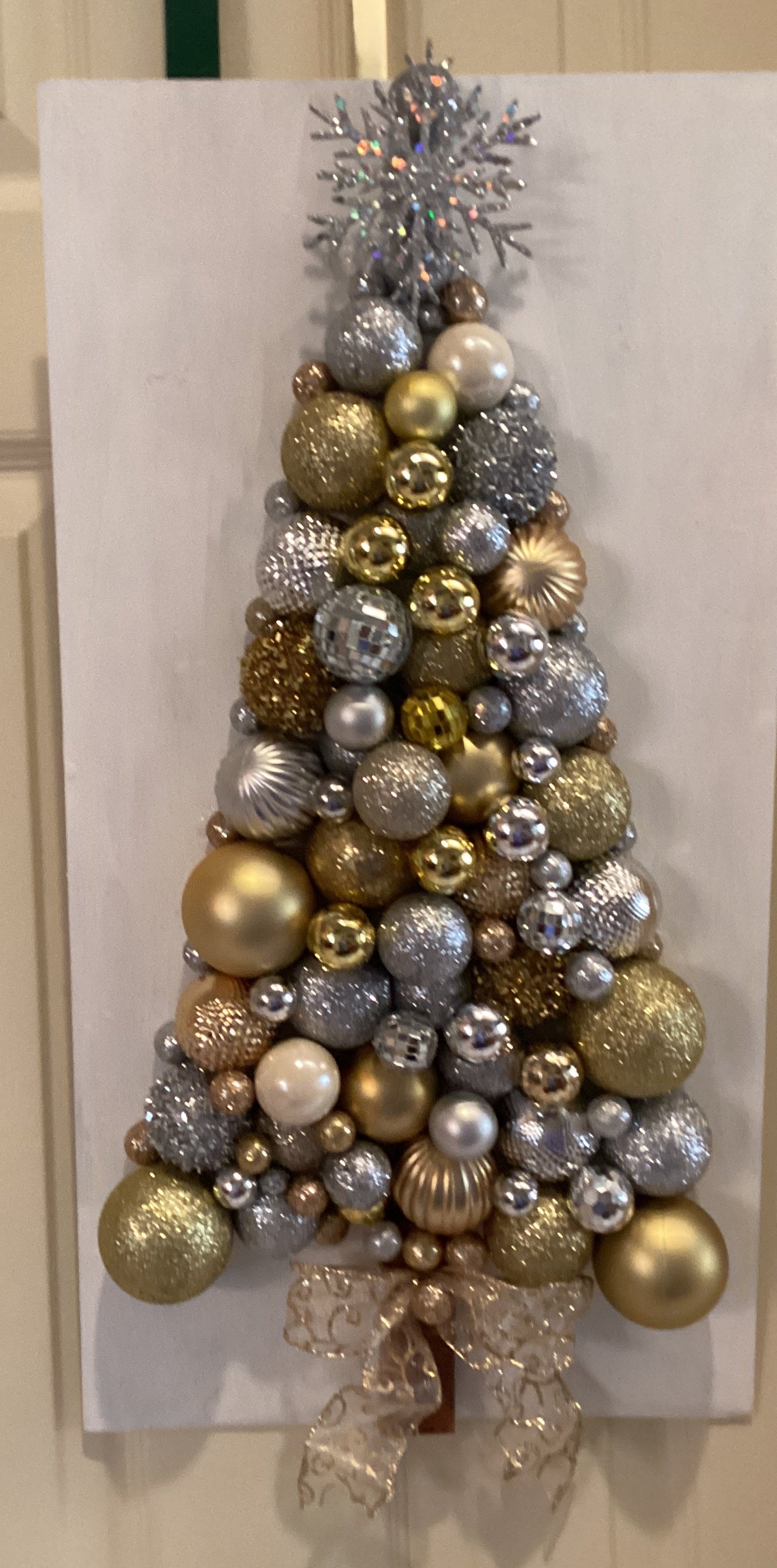 Christmas tree made from gold and silver ornaments Media 1 of 3 - front