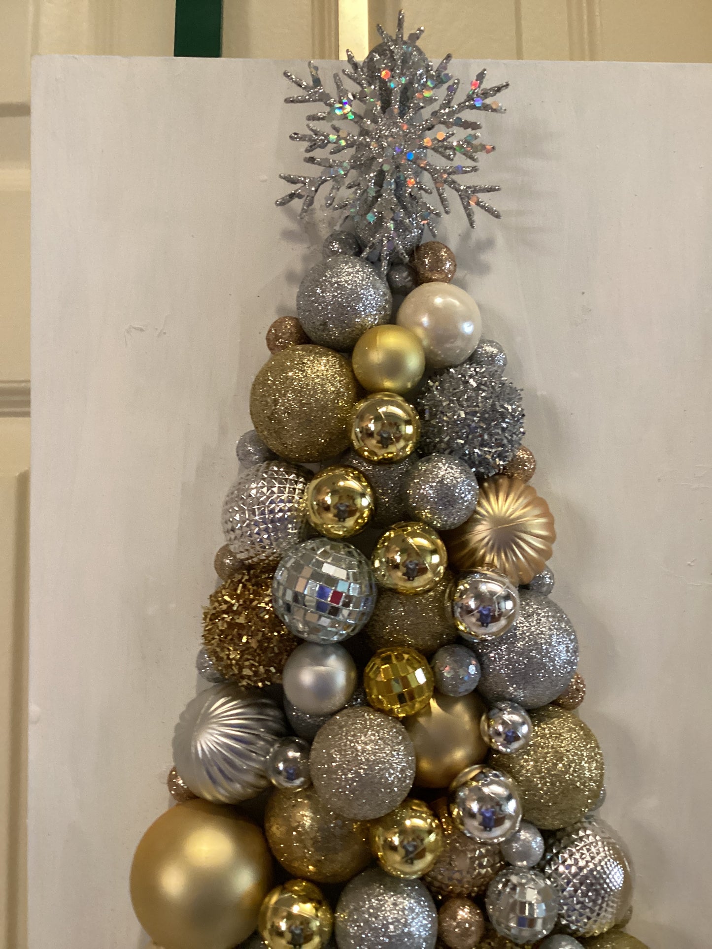 Christmas tree made from gold and silver ornaments Media 1 of 3 - view of top