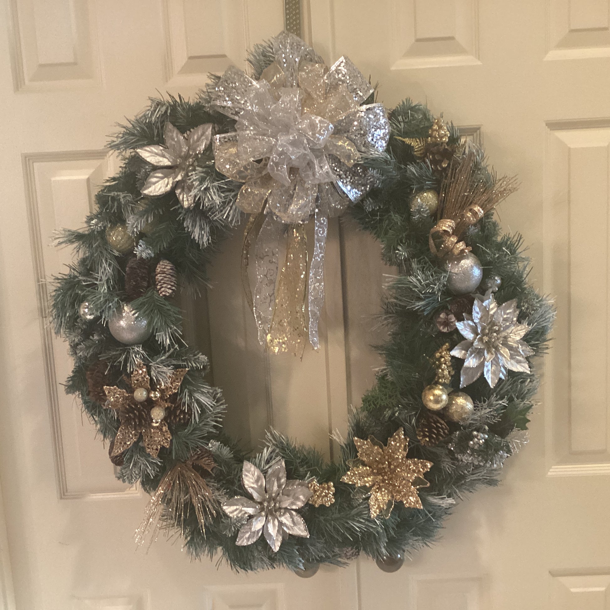 Gold and Silver Poinsettia Christmas Wreath on Greenery-front