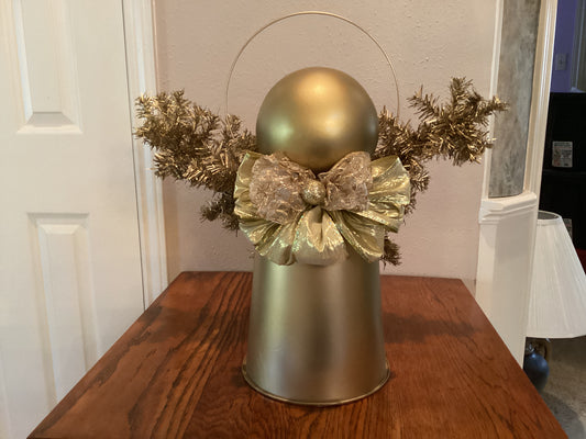 Gold Christmas angel with gold bow, halo, and wings