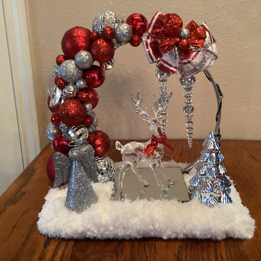 Red andn silver reindeer centerpiece-front side